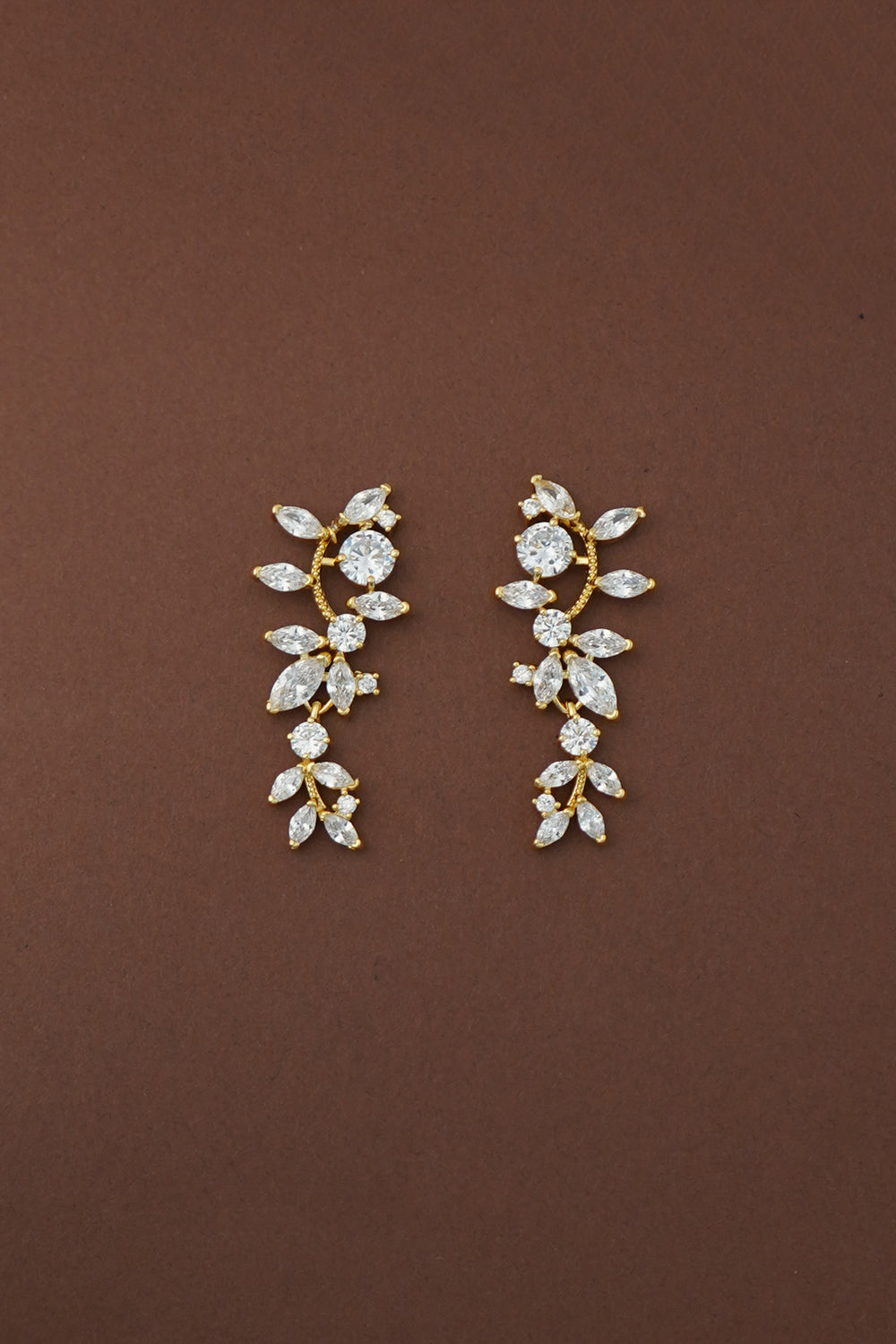 Gold-tone simulated diamond drop earrings with marquise and round stone clusters