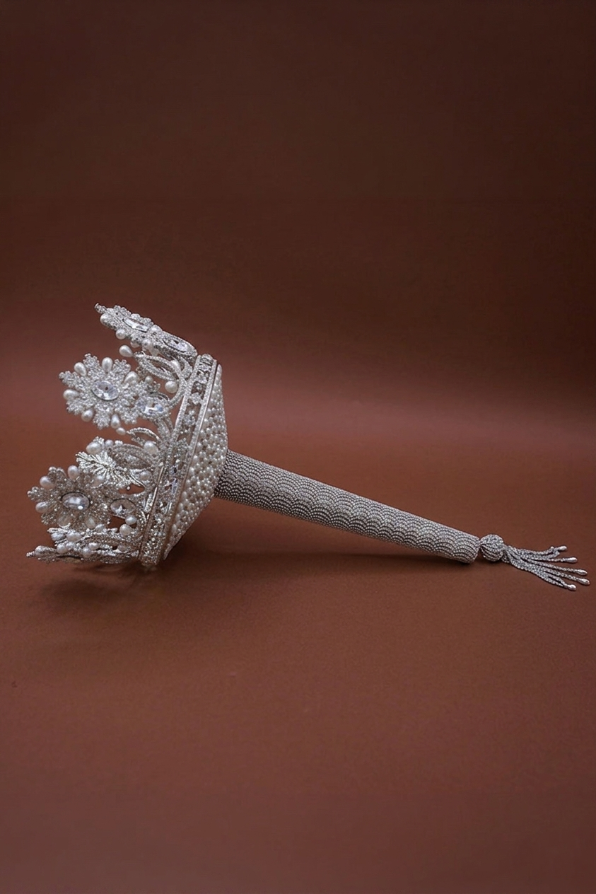 Silver-tone crystal crown bouquet holder with long mesh beaded handle, side view