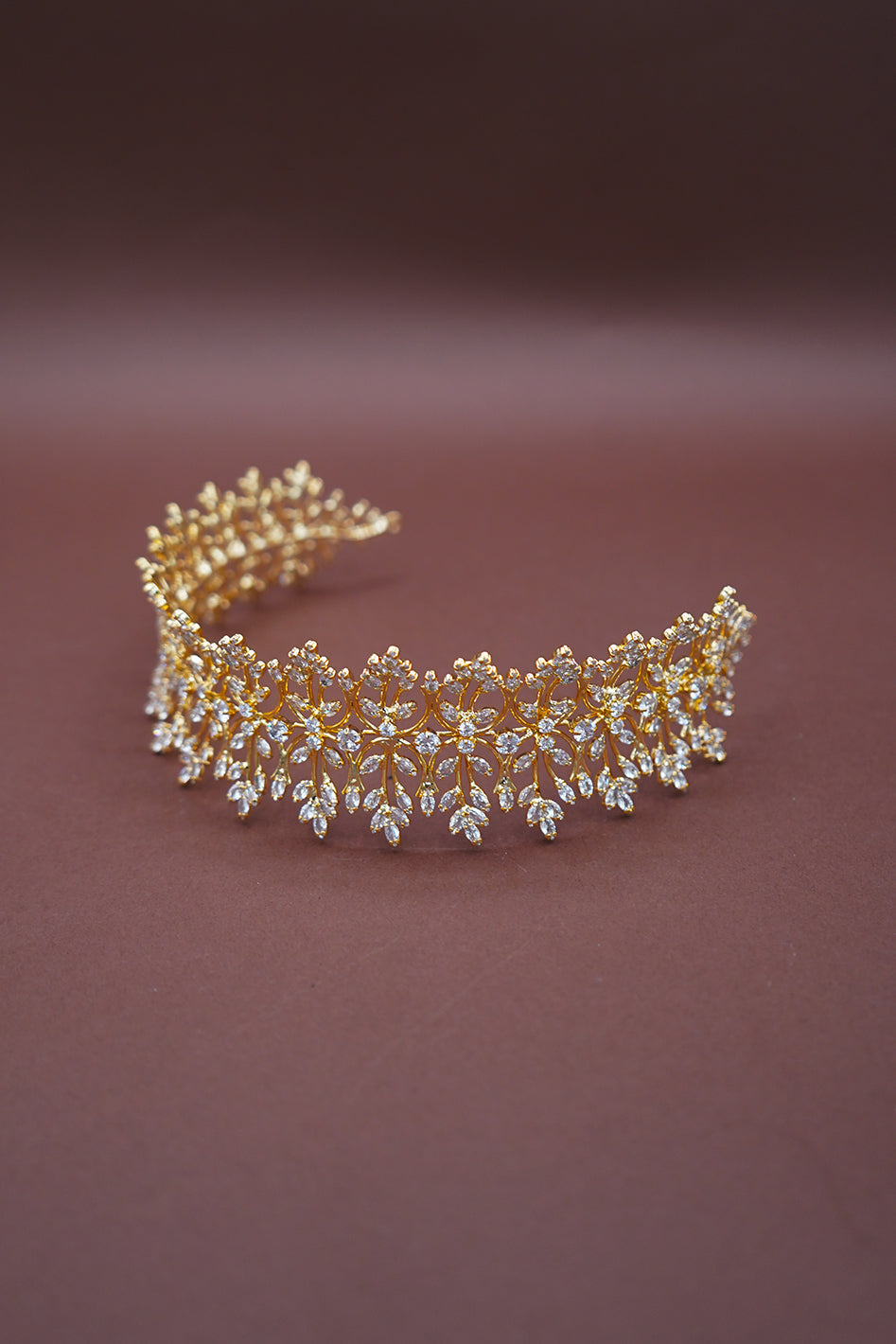 Gold and crystal Headband on a brown background

