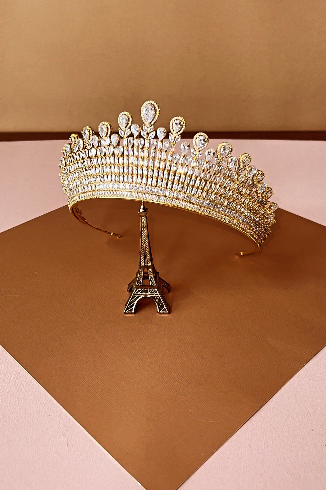 Gold-tone crystal tiara crown with arched band and oval rhinestone accents